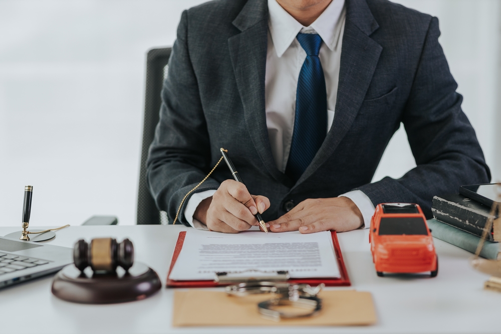 Car Accident Lawyer sitting at desk