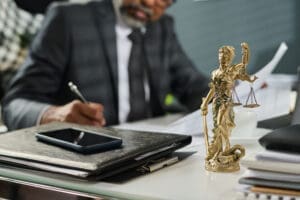 Themis statuette on workplace of lawyer